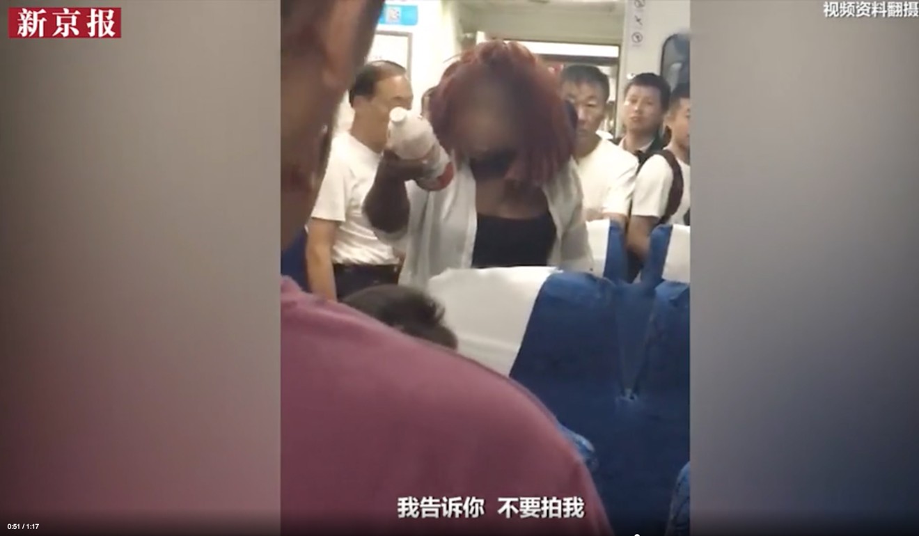 The woman threw water at her fellow passengers when they filmed her altercation after she was accused of taking someone else's seat. Photo: the paper