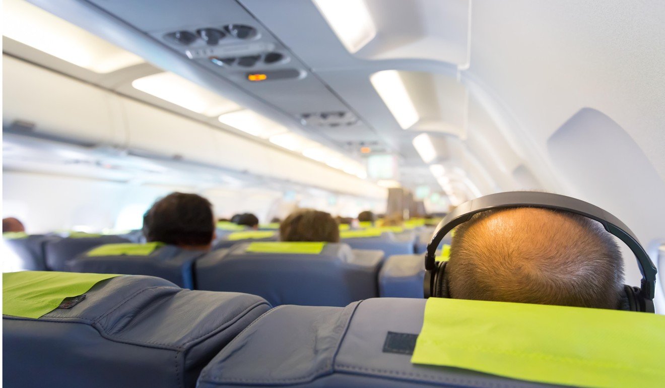 A pair of noise-cancelling headphones will come in handy on a plane. Photo: Alamy