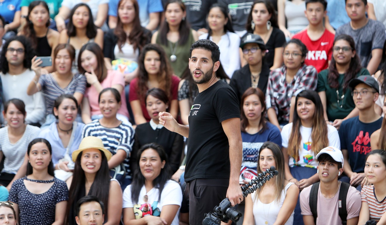 Travel vlogger Nuseir Yassin, also known as Nas of NAS Daily, meeting fans and filming for his Facebook page at the Olympics Square in Hong Kong Park on Tuesday. Photo: Winson Wong