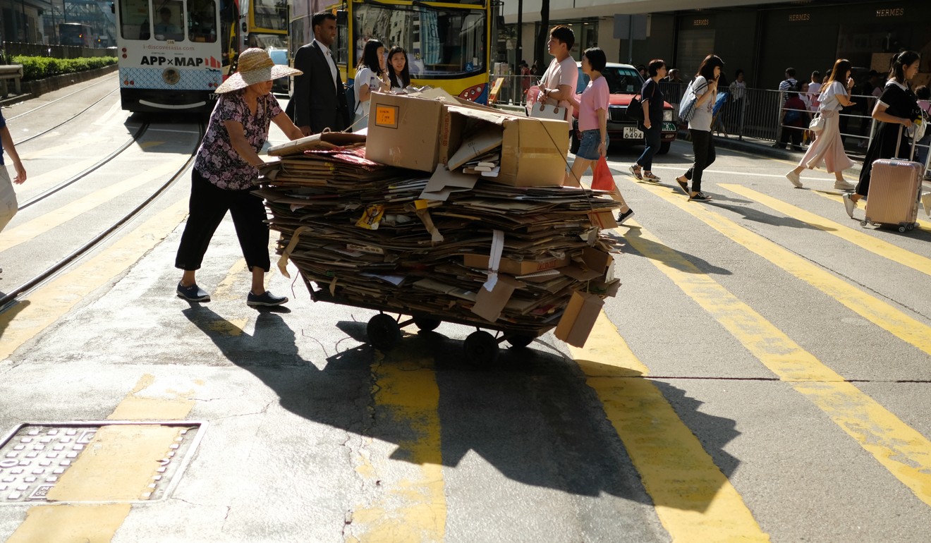 An elderly woman collects scrap cardboard to sell. One in three elderly Hongkongers lives below the poverty line. Photo: Fung Chang