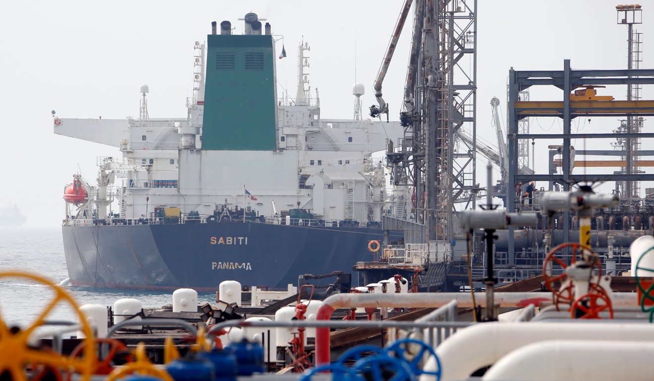 A tanker docks at an oil facility on Khark Island, on the shore of the Gulf. Photo: AFP
