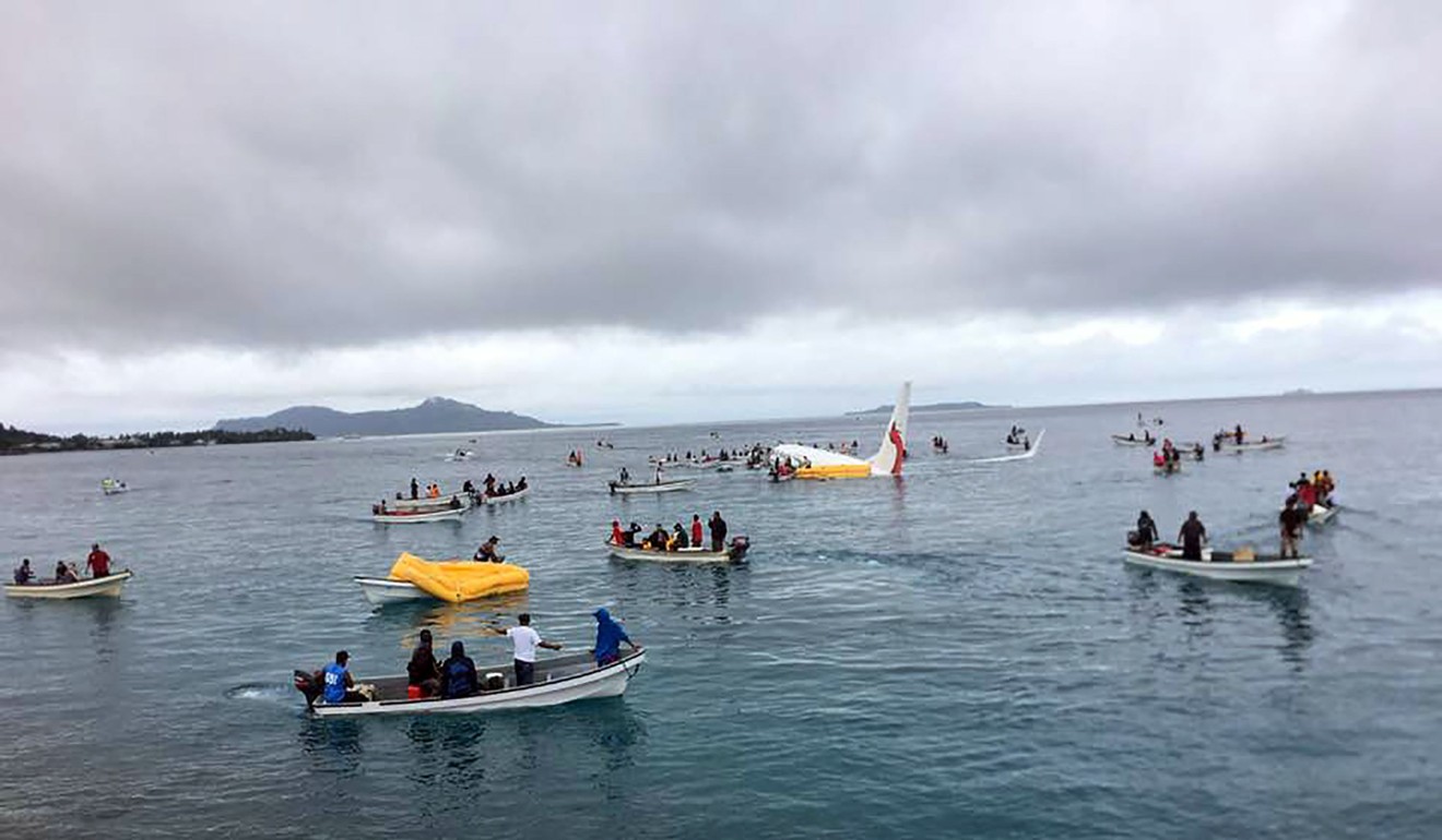People are rescued from an Air Niugini plane which crashed in the waters in Weno, Chuuk, Micronesia on September 28, 2018. Photo: James Yaingeluo/Reuters