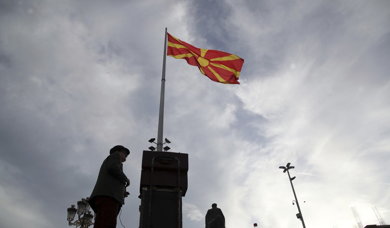 The Macedonian flag flies over the main square of Skopje. Photo: AP