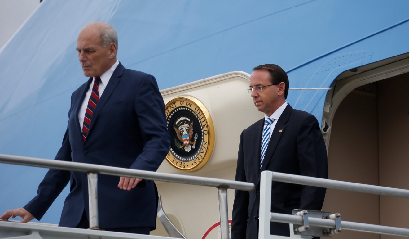 Deputy Attorney General Rod Rosenstein, right, leaves Air Force One with White House Chief of Staff John Kelly in Orlando, Florida on Monday. Photo: Reuters