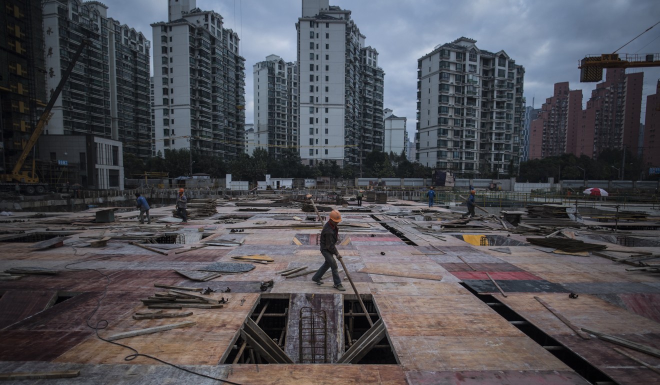 A man works on the construction site of a residential skyscraper in Shanghai in November 2016. Yin-yang contracts are commonplace in both the construction industry and property market. Photo: AFP