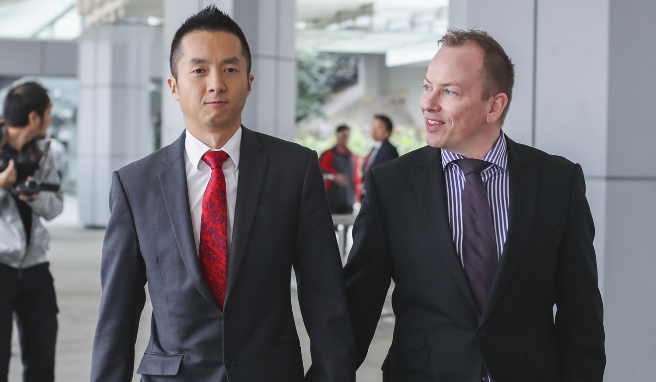 Angus Leung (left), a senior immigration officer in Hong Kong, and his partner Scott Adams leave the High Court in Admiralty on December 12, 2017. Leung lodged a judicial challenge after Adams, whom he married in New Zealand in 2014, was refused spousal benefits. Photo: Winson Wong