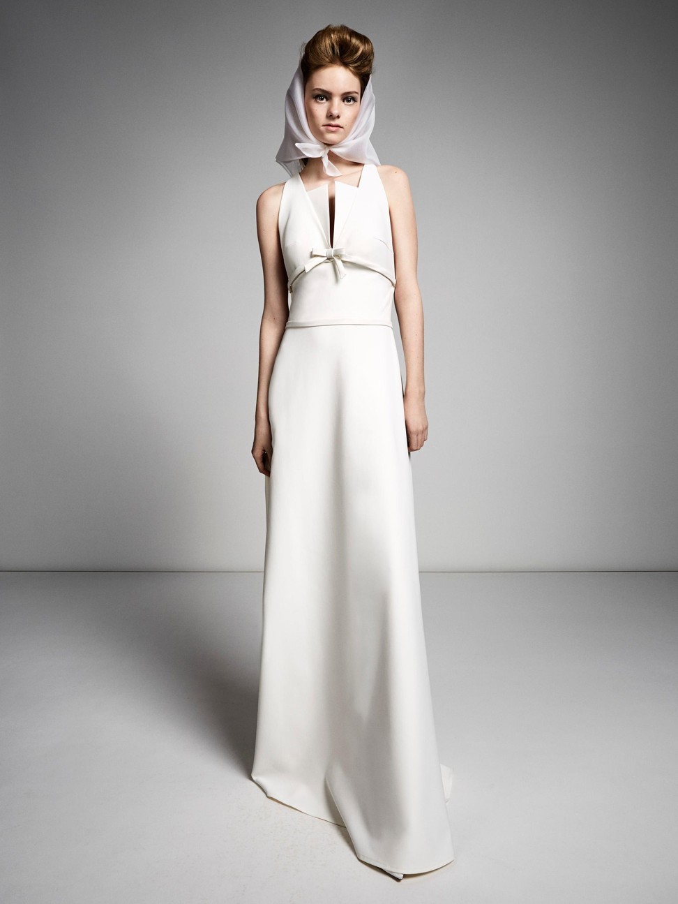 A vintage Viktor & Rolf A-line gown embellished with a cross back and a petite bow