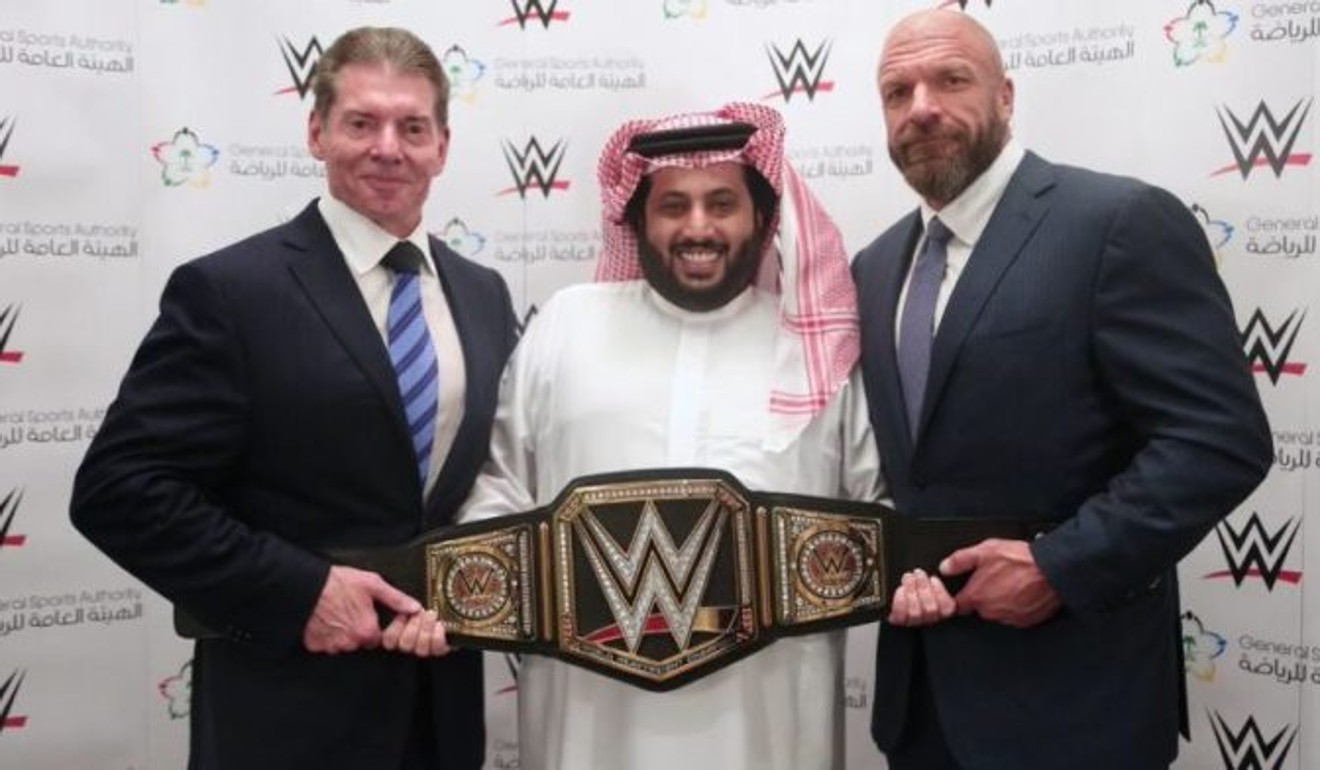 Vince McMahon (left) and Triple H (right) pose with Saudi sports chief Turki Al-Sheikh