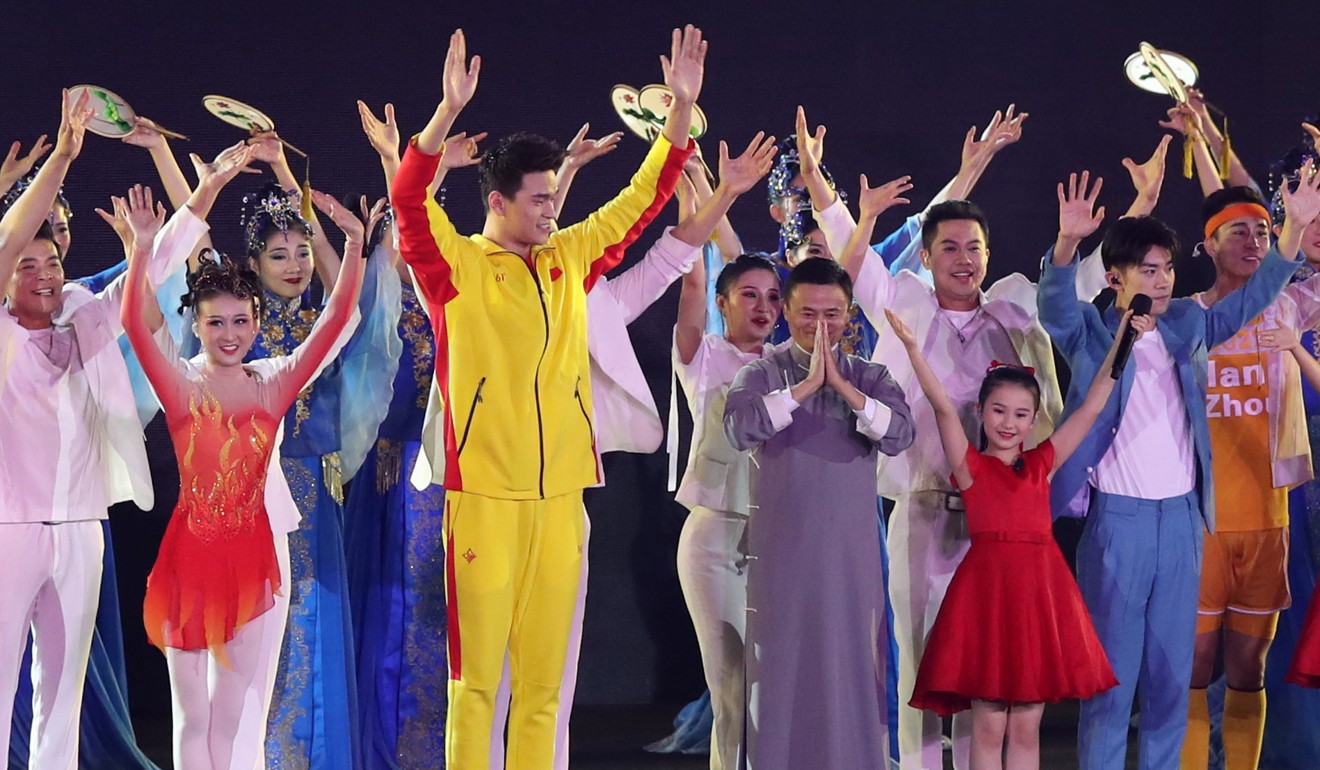 Sun Yang and Jack Ma at the Jakarta Asian Games closing ceremony. Photo: Xinhua