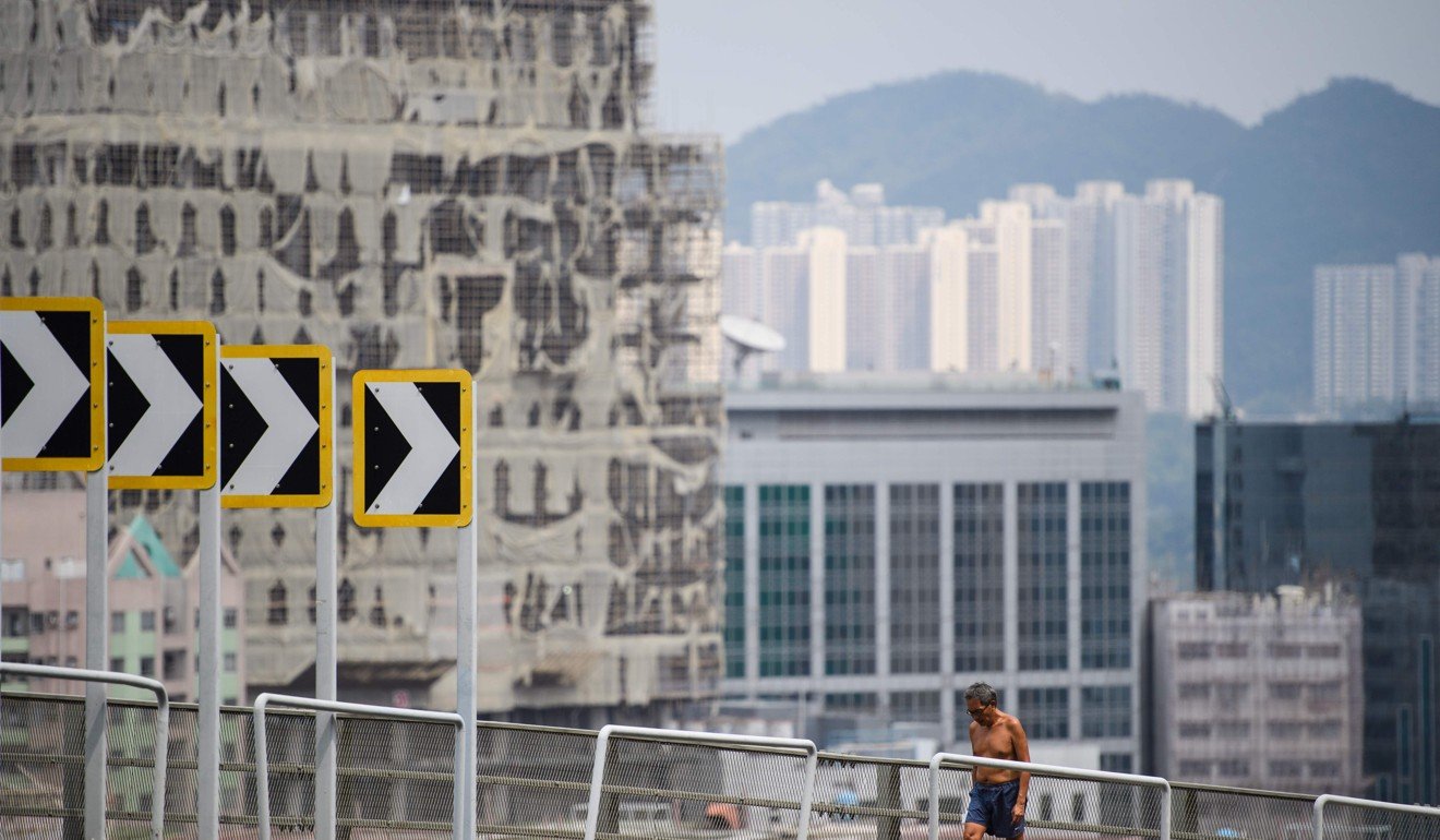 Two of Hong Kong's biggest banks raised their lending rates on September 27 for the first time in 12 years, ending an age of cheap cash that could hit the city's famously red-hot property market. Photo: AFP