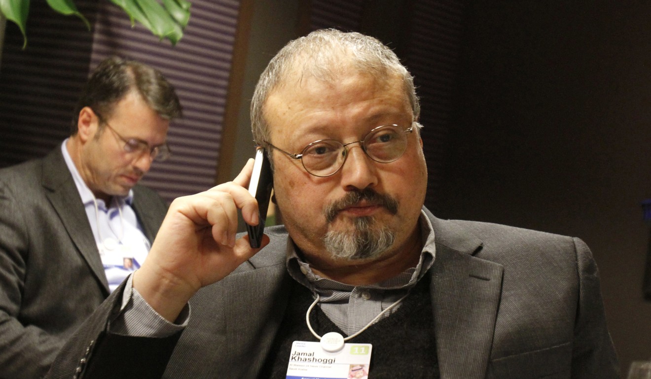 Jamal Khashoggi speaks on his cellphone at the World Economic Forum in Davos in 2011. Photo: AP