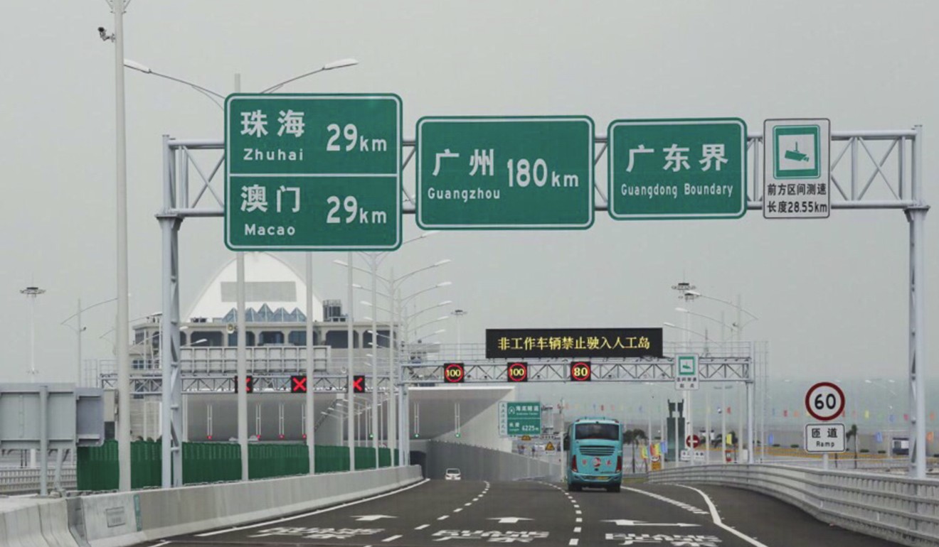 The first cars and buses started crossing the Hong Kong-Zhuhai-Macau Bridge on Wednesday. Photo: K.Y. Cheng