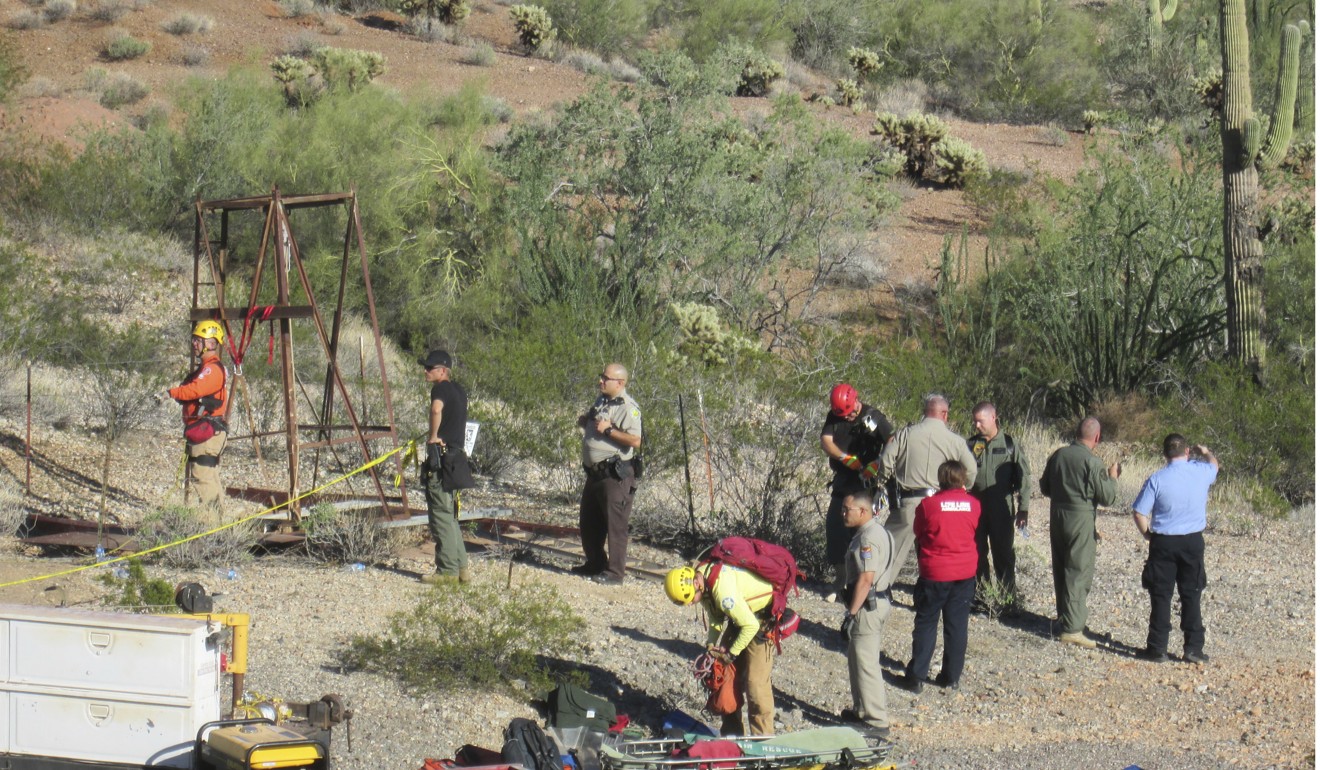 A eescue team gathers prepares to pull John Waddell out of the mine shaft. Photo: AP