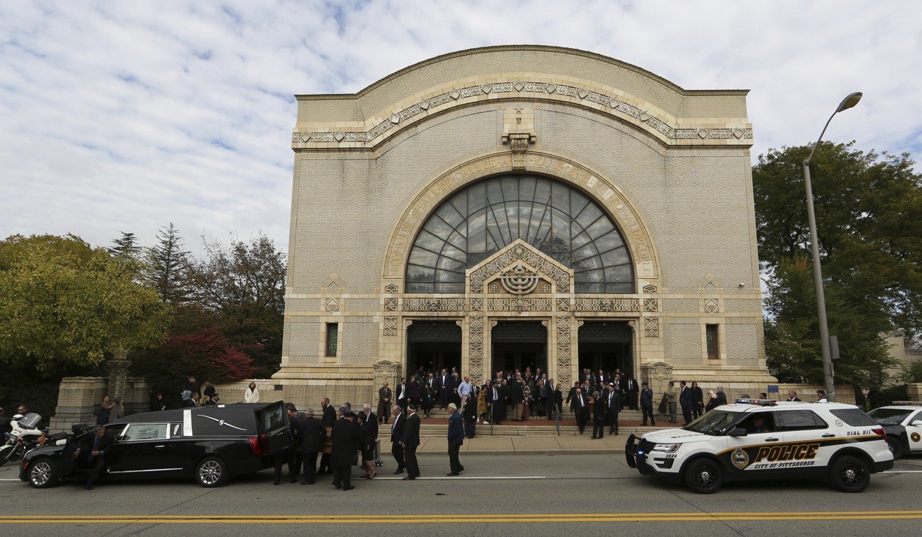 Caskets are carried out of Rodef Shalom Congregation after the funeral services for brothers Cecil and David Rosenthal on Tuesday in Pittsburgh. The brothers were killed in the mass shooting on Saturday at the Tree of Life Synagogue. Photo: AP