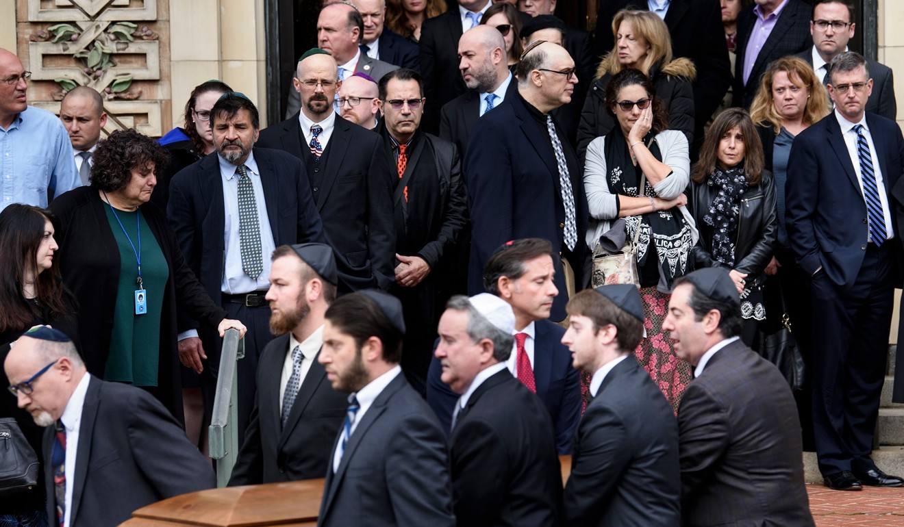 Pallbearers carry a casket from Rodef Shalom Congregation after the funeral for brothers Cecil Rosenthal and David Rosenthal on Tuesday in Pittsburgh. Photo: Agence France-Presse