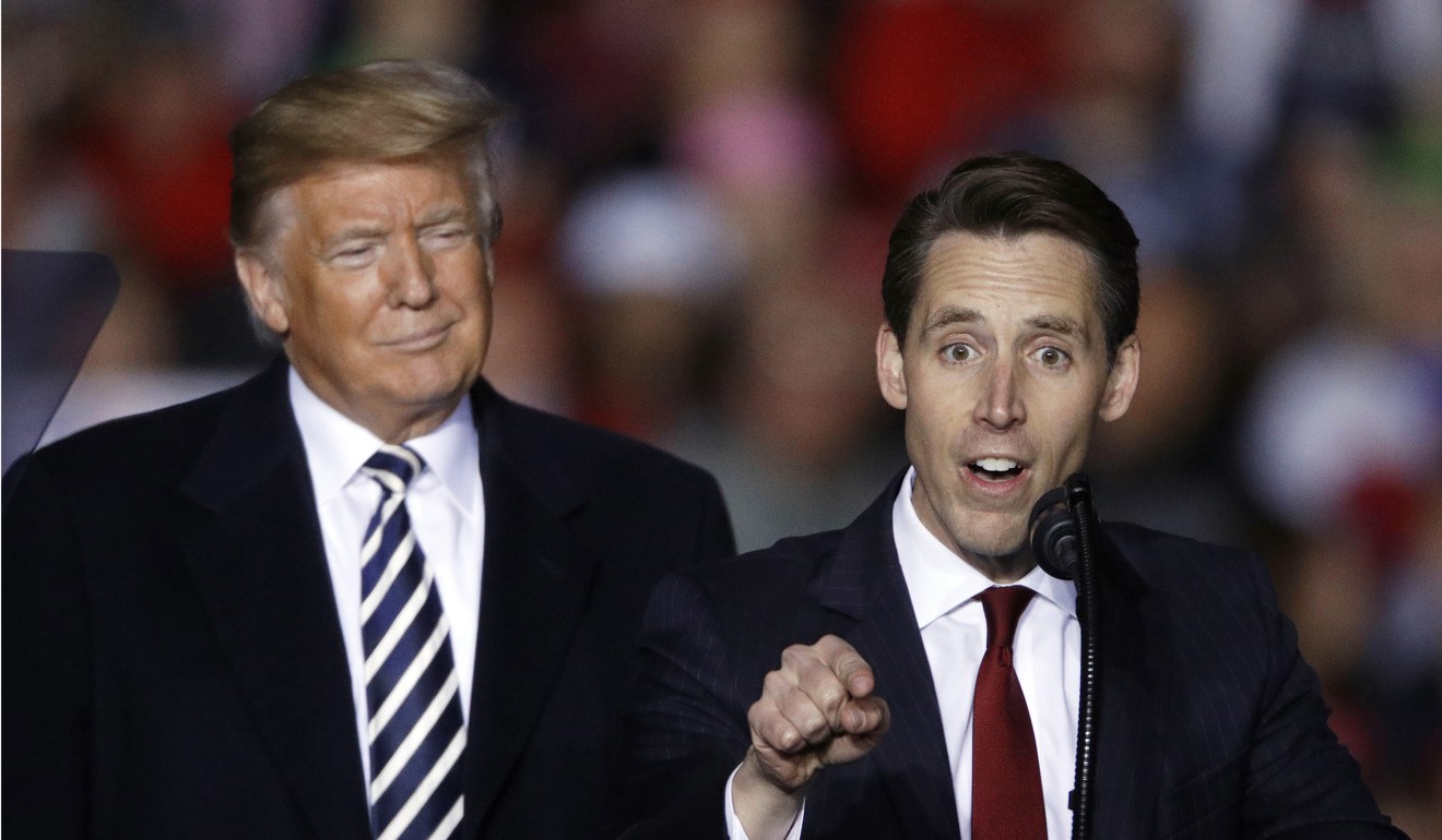President Trump listens as Republican Senate candidate Josh Hawley speaks during a campaign rally on Thursday in Missouri. Photo: AP