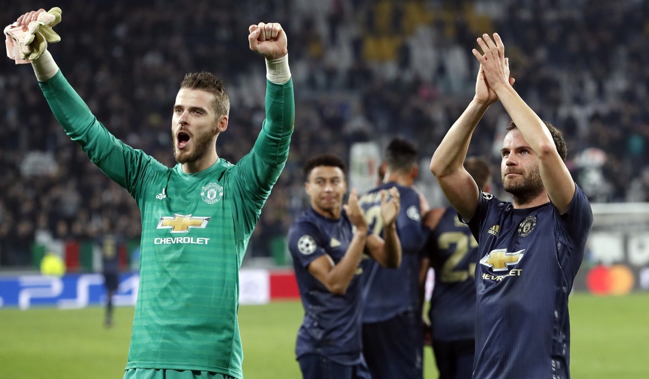 Manchester United players celebrate an unlikely win at Juventus. Photo: AP
