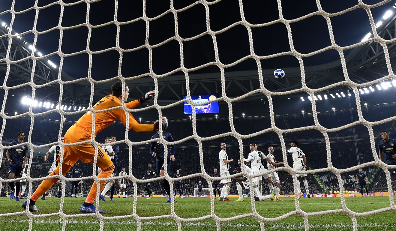 Juventus goalkeeper Wojciech Szczesny dives after Juan Mata’s free-kick. Photo: AFP
