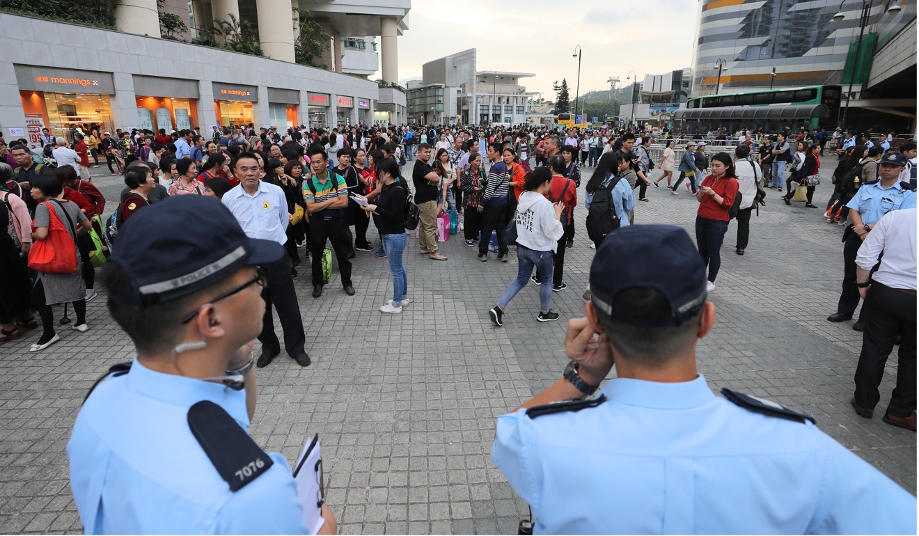 Police officers were in Tung Chung throughout the day checking licences. Photo: Winson Wong