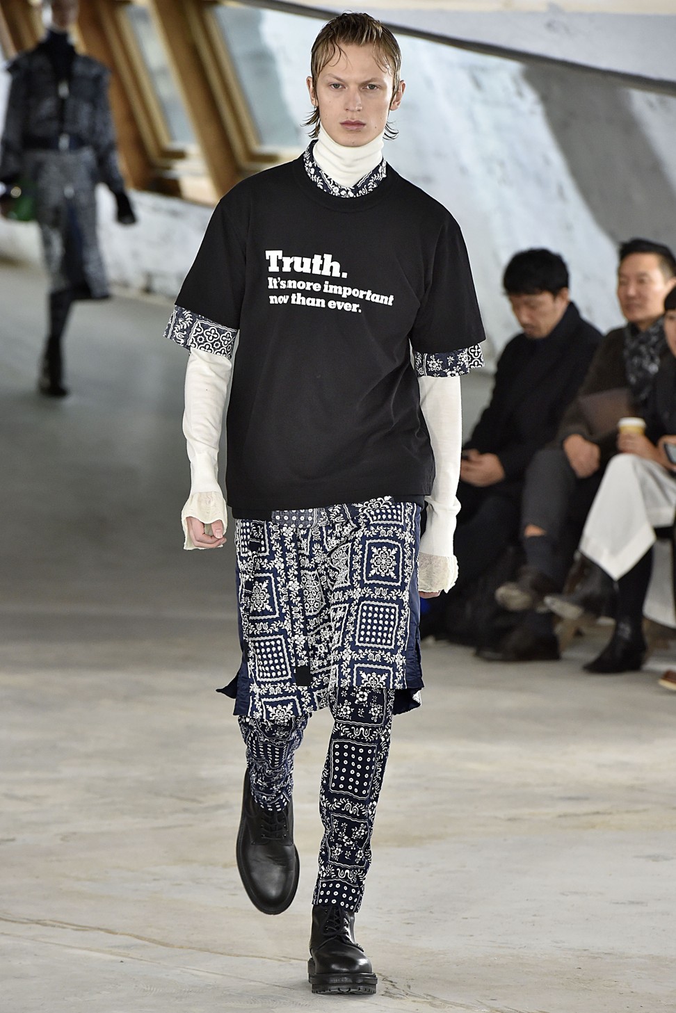 A look featuring a slogan from The New York Times ‘Truth’ campaign at Sacai Paris Fashion Week.