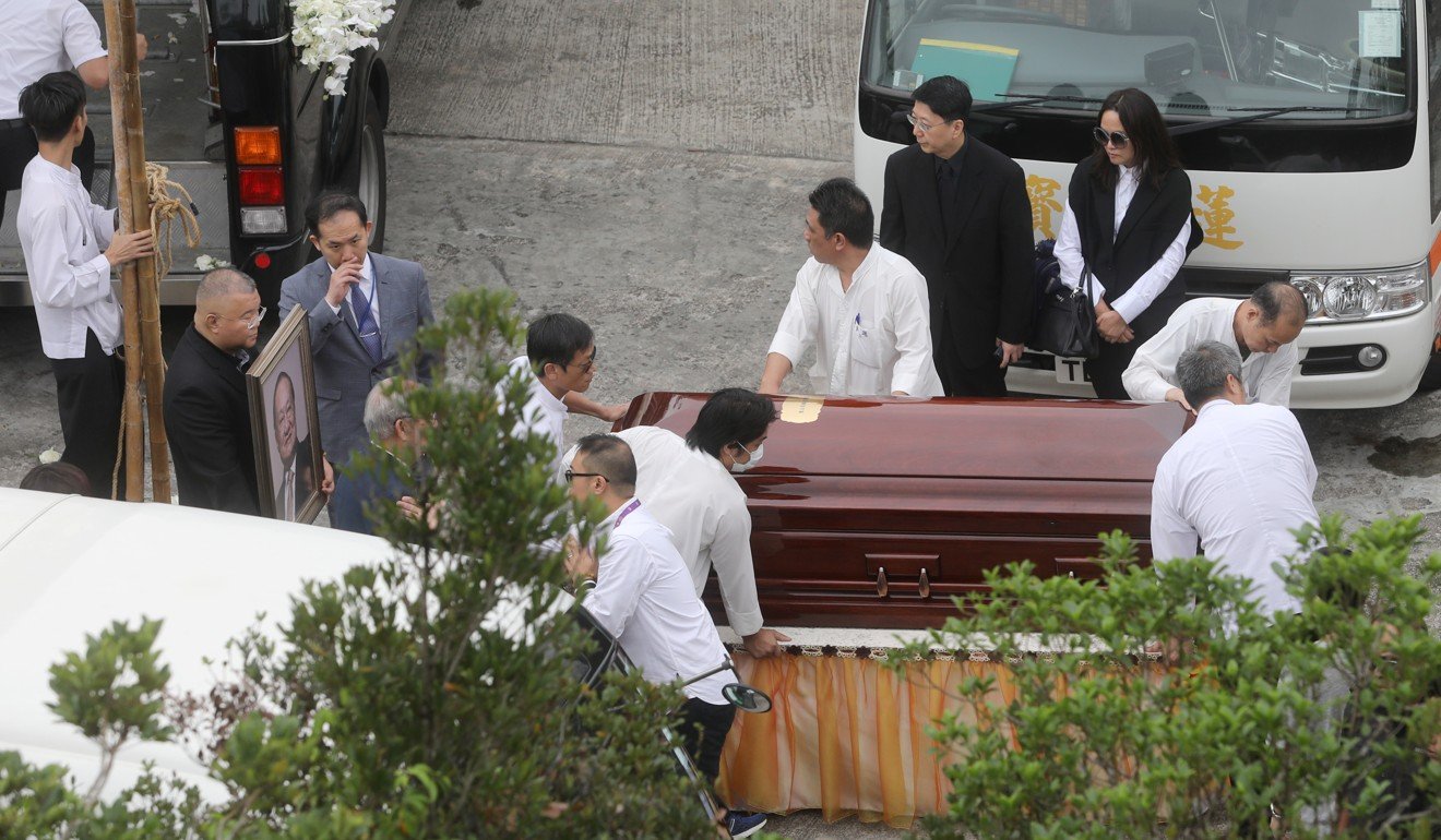 Staff carrying coffin of Louis Cha to Po Lin Monastery, Lantau Island. Photo: Sam Tsang