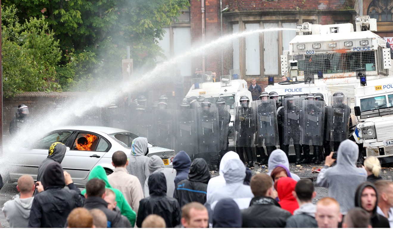 A water cannon being used on protesters in Belfast, Northern Ireland. Photo: AFP