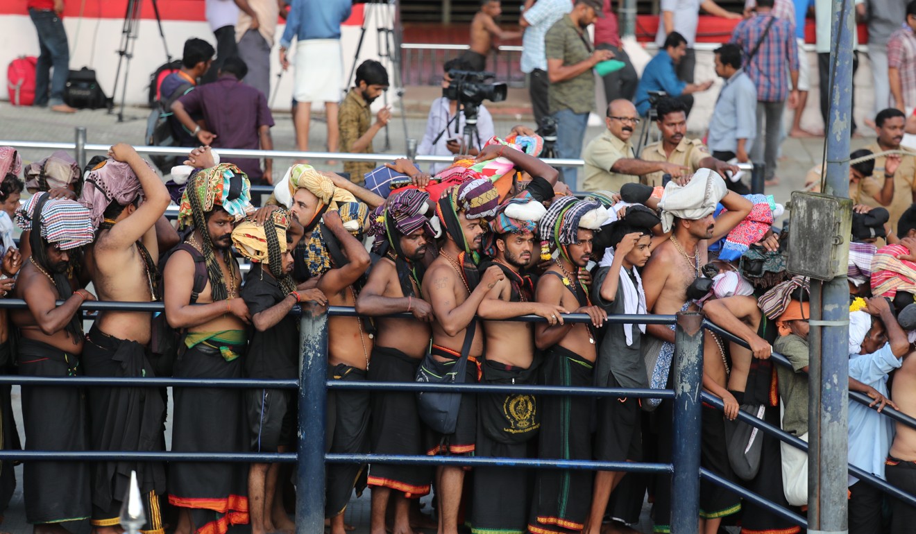 Devotees carrying customary offerings on their heads, queue up to worship at the Sabarimala temple, one of the world's largest Hindu pilgrimage sites in Kerala state. Photo: AP
