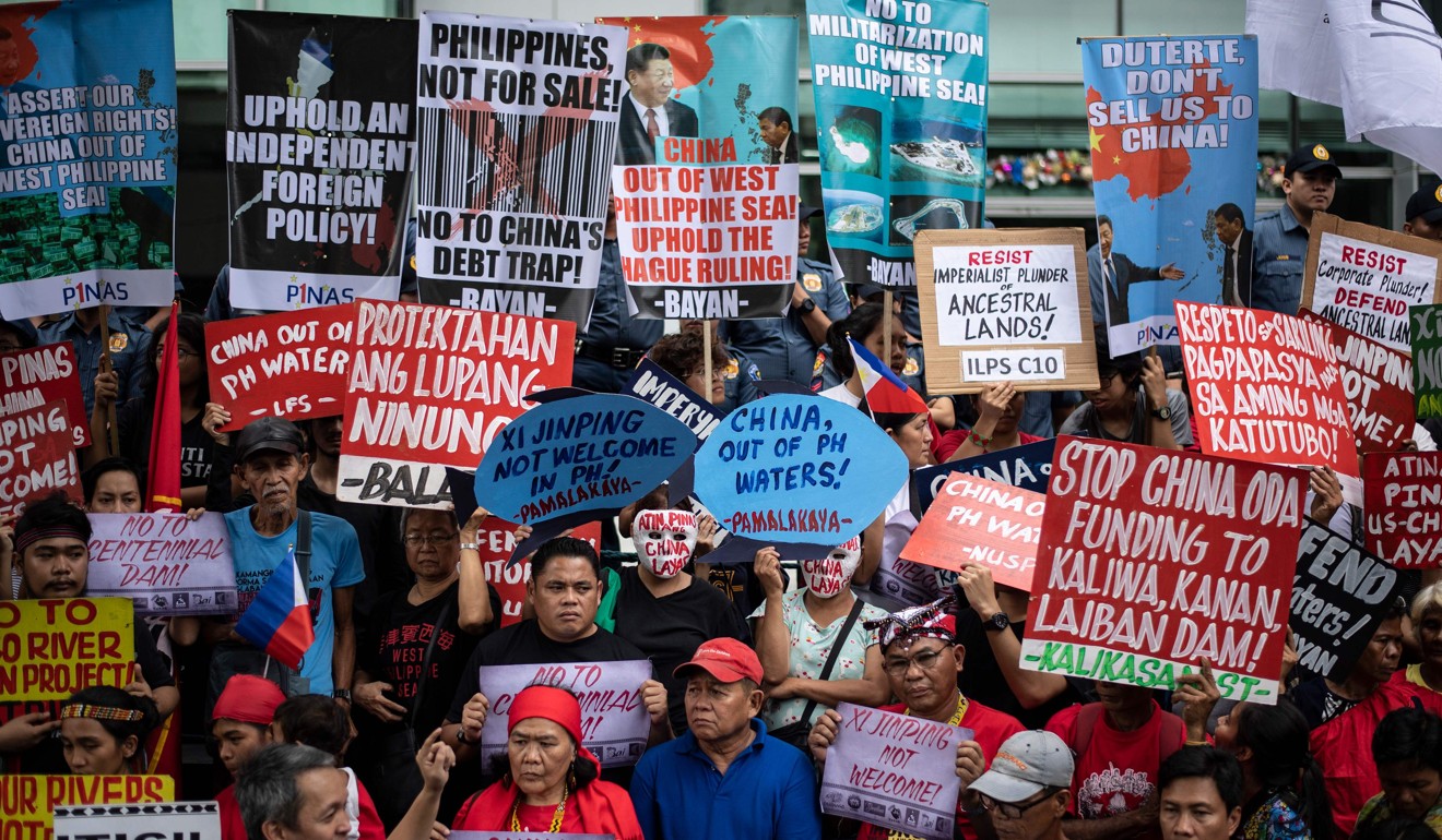 Activists protest in front of the Chinese embassy in Manila on Tuesday. Photo: AFP