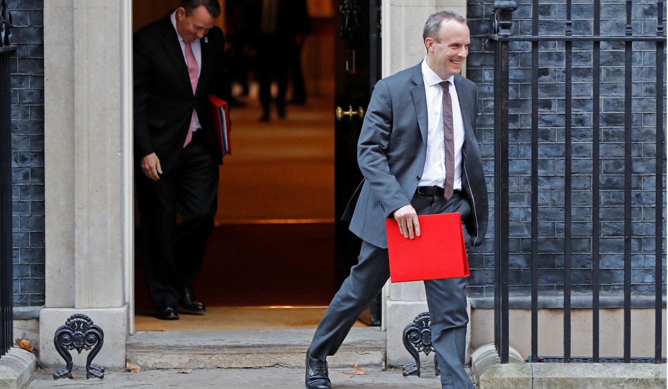 Britain’s International Trade Secretary Liam Fox (left) and Brexit minister Dominic Raab leave after attending the weekly meeting of the cabinet at 10 Downing Street in London on November 13. On November 15, Raab resigned. Photo: AFP