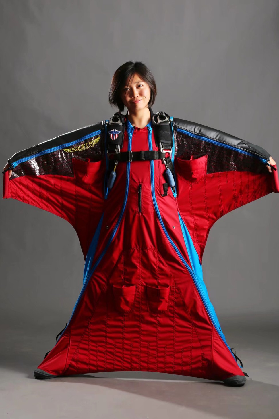 Yu Yin shows off the wingsuit she wore for her Himalayas flight. Photo: Handout