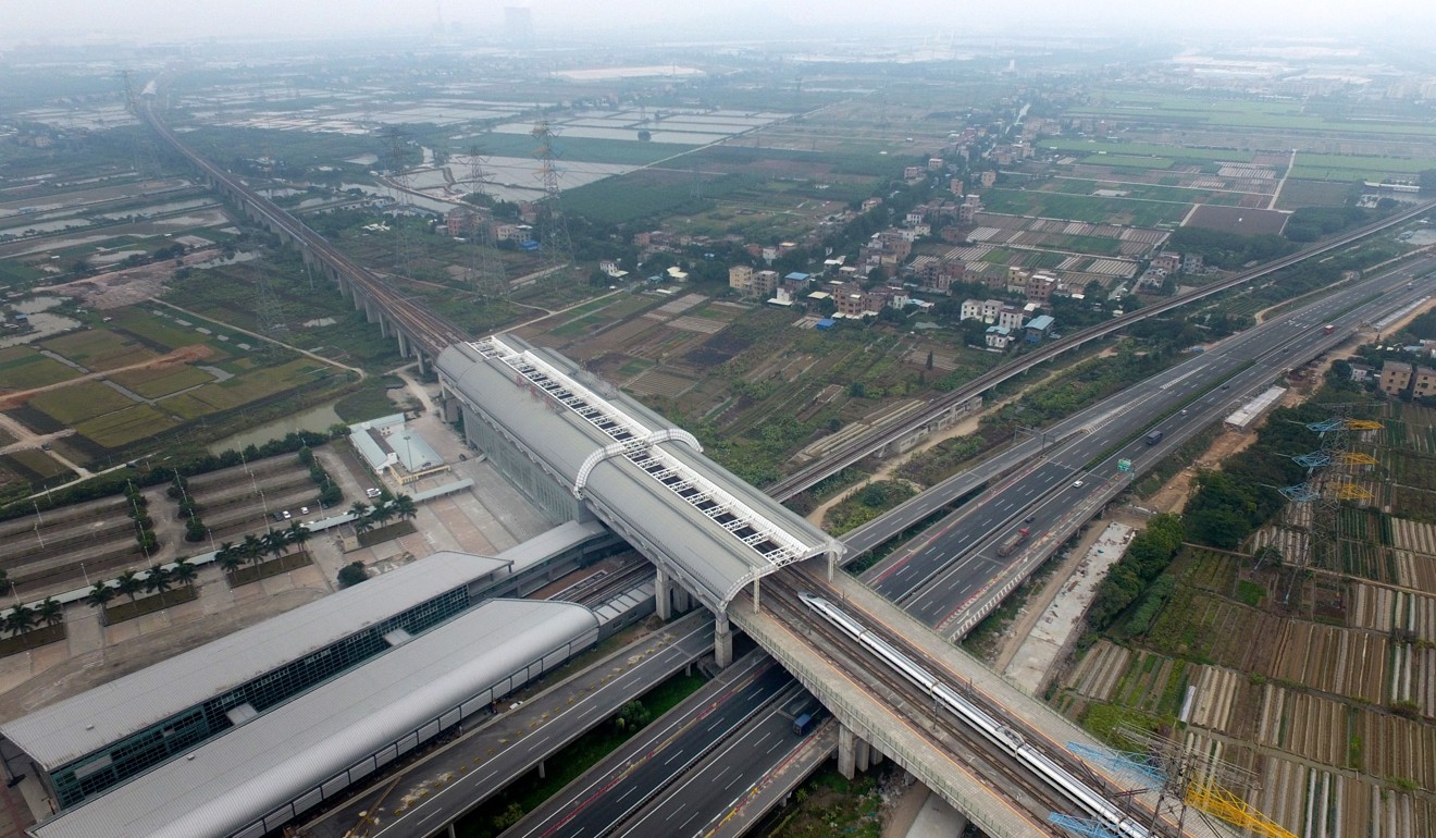 A bullet train enters the Qingsheng Station of the Guangzhou-Shenzhen-Hong Kong Express Rail Link in Guangzhou. A former top Shenzhen official has advocated the free flow of captial and movement in the Greater Bay Area. Photo: Xinhua
