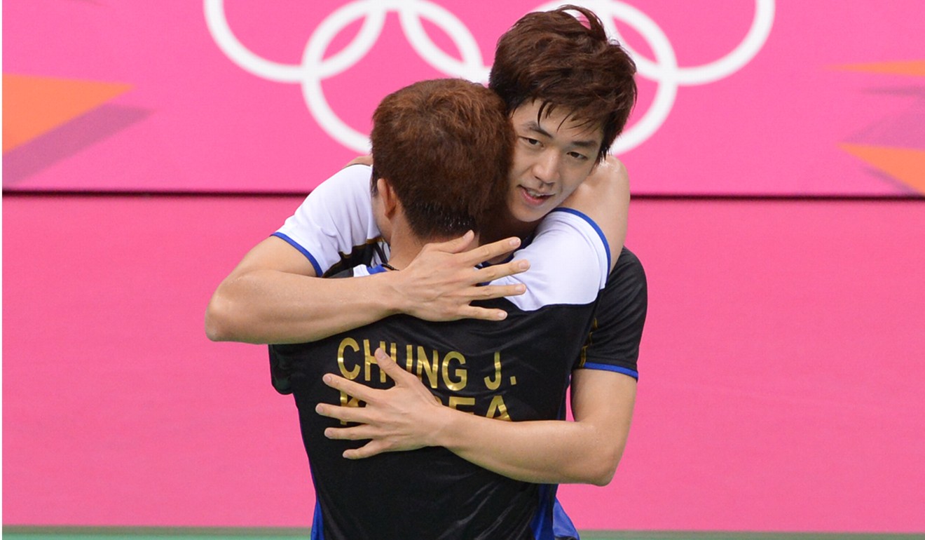 South Korea’s Lee and Jung (foreground) celebrate together after winning the bronze medal in the badminton men’s doubles at London’s 2012 Olympic Games. Photo: AFP