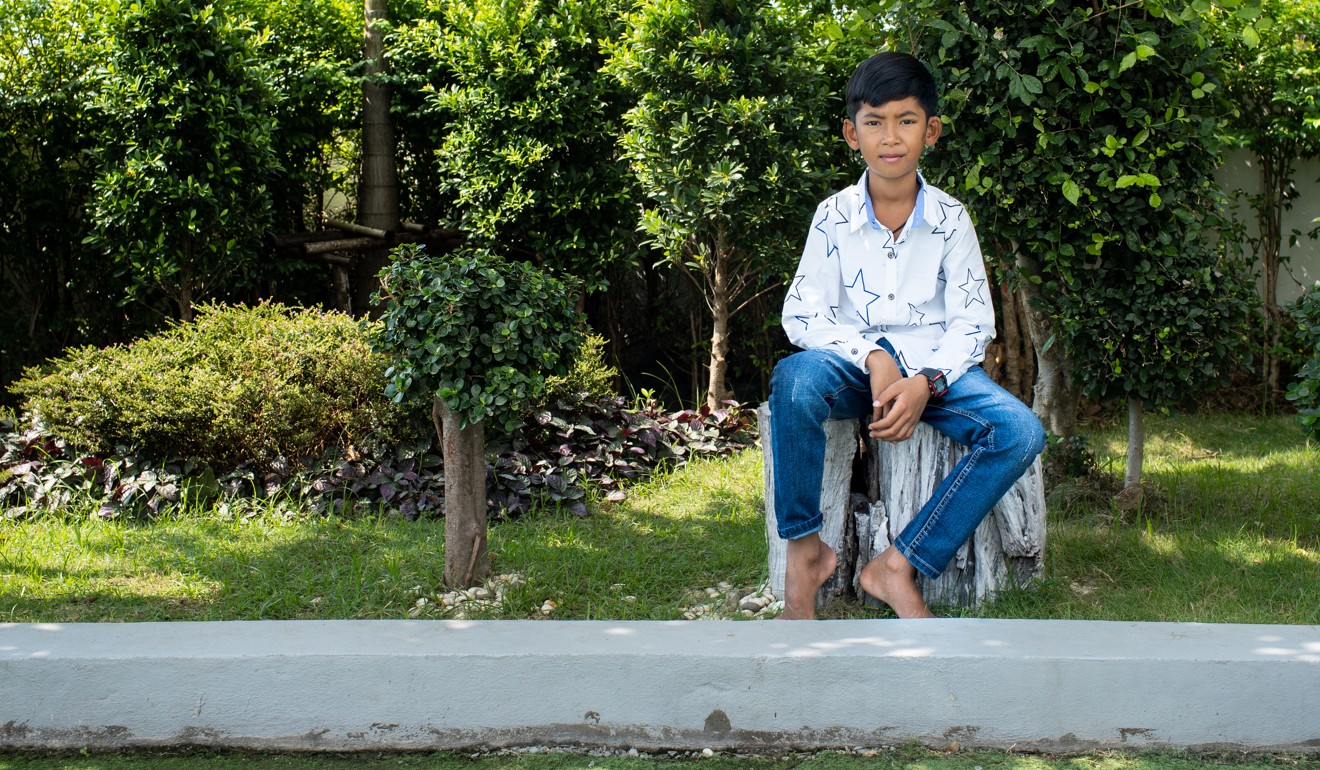 Thuch Salik poses for a portrait. The multilingual Cambodian internet sensation hopes to travel to China. Photo: Enric Català