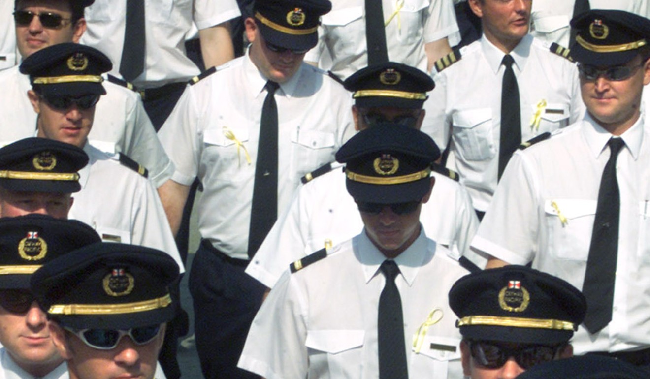 Cathay pilots march to a meeting with the company in 2001 over labour disputes. Photo: Reuters