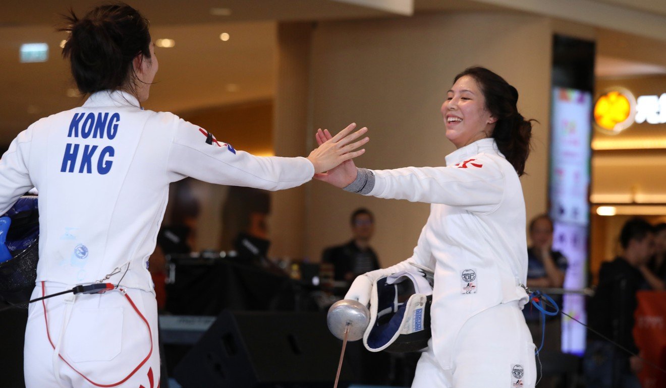 Natalie Chan (right) congratulates Vivian Kong in the semi-finals of their épée duel.