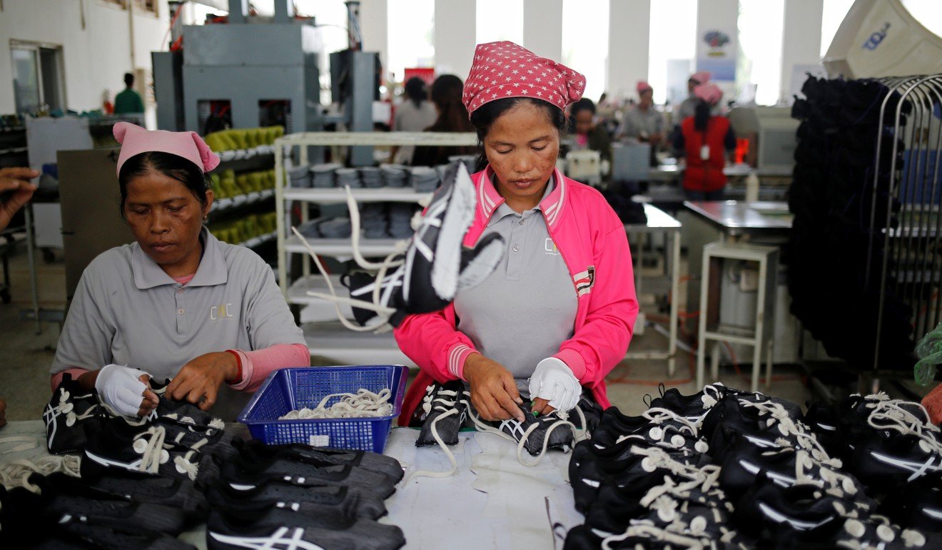 Women in Kampong Speu, Cambodia, work on the production line at Complete Honour Footwear Industrial, a factory owned by a Taiwanese company, in July. Taiwan is trying to delink its economy from the mainland by focusing on Southeast Asia but progress has been slow. Photo: Reuters