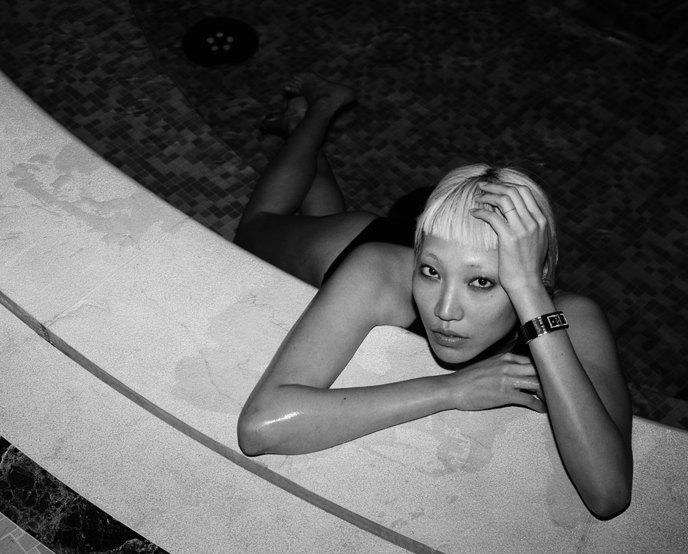 Model and DJ Soo Joo Park wears the new CODE COCO timepiece by Chanel in the pool at the Ritz Paris.