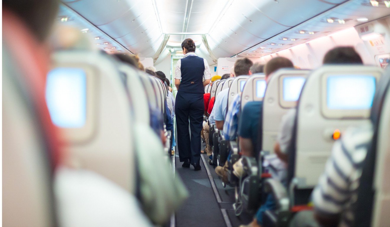 File photo of a stewardess on an aeroplane. Photo: Alamy