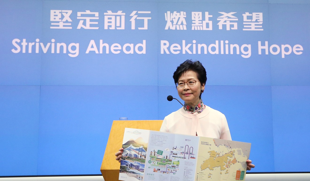 Chief Executive of Hong Kong, Carrie Lam displaying a pamphlet regarding the Lantau Tomorrow Vision proposal, which she announced in her policy address in October. Photo: Dickson Lee