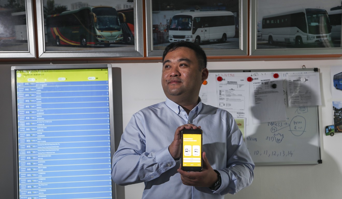 Roy Tsang, director of Jojobus, showing the app which customers can use to rent the company’s buses. Photo: Xiaomei Chen