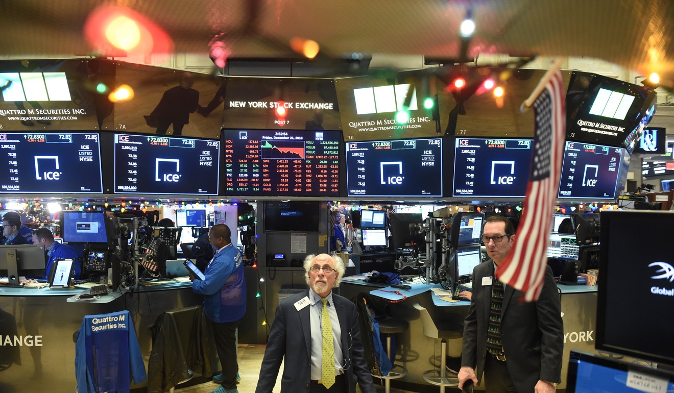 Traders work on the floor of the New York Stock Exchange on Friday. Photo: Reuters