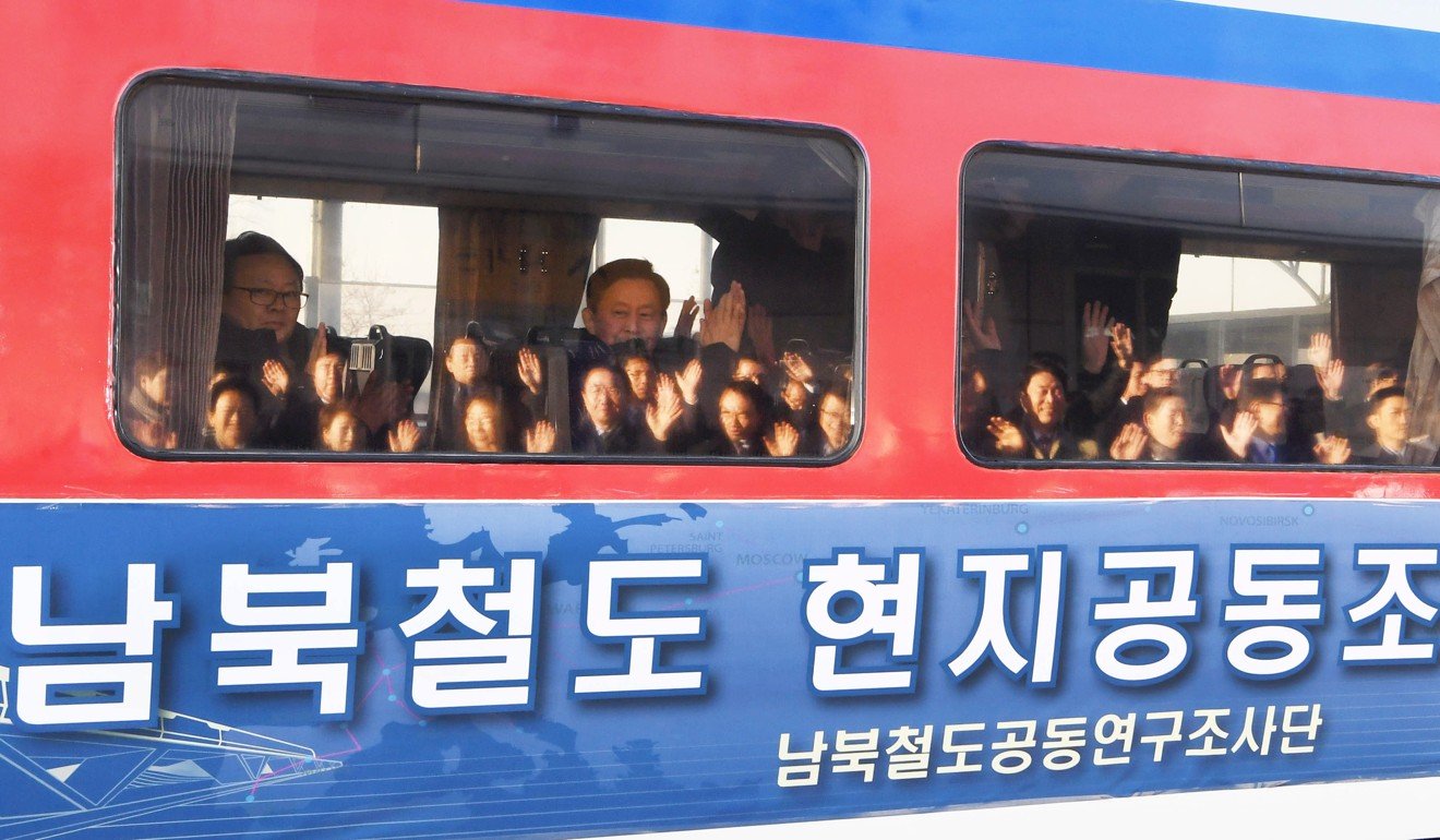 Members of a South Korean delegation wave to well-wishers before departing across the border to carry out a joint inspection of North Korea’s railways. Photo: EPA