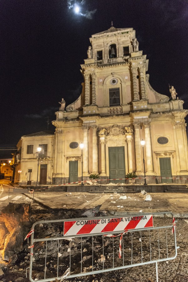 Debris litters the road outside the damaged Sacro Cuore (Holy Heart) Church in Santa Venerina, Sicily. Photo: AP