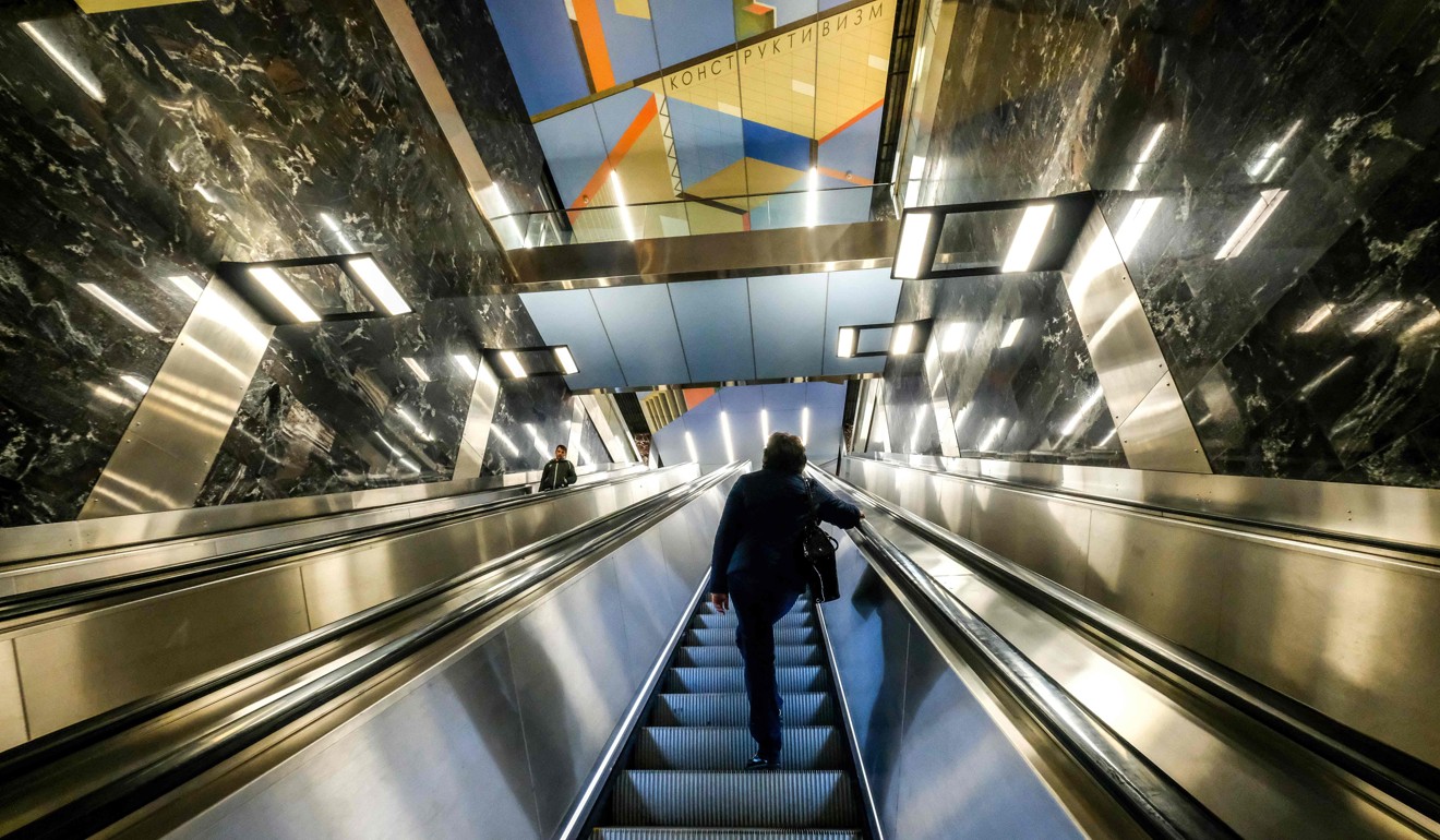 A man stands on an escalator at Khoroshevskaya metro station in Moscow. Photo: AFP