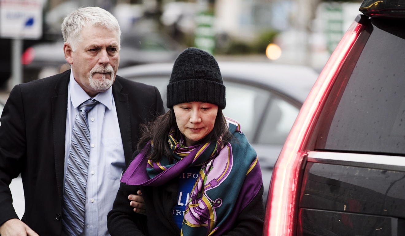 Huawei chief financial officer Meng Wanzhou arrives at a parole office with a security guard in Vancouver on December 12, 2018. Photo: AP