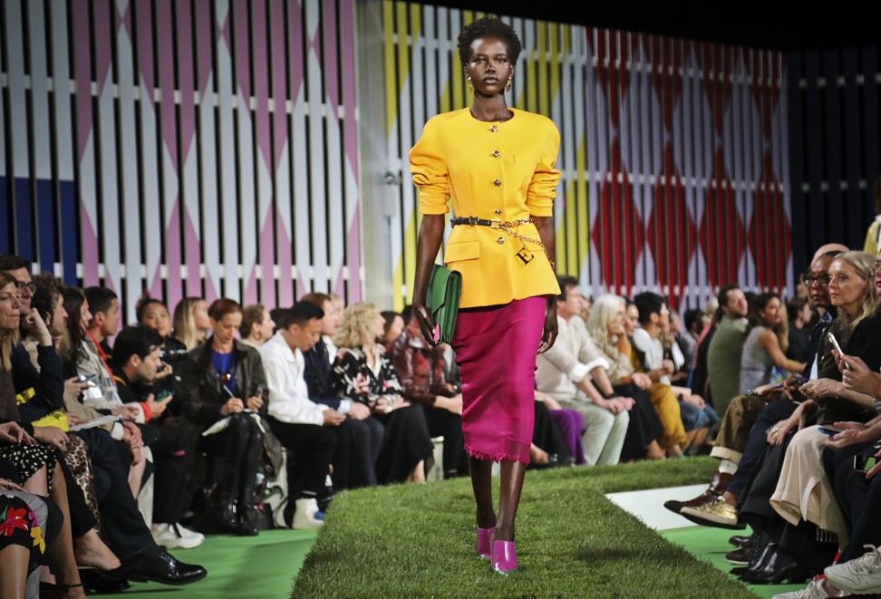 Escada’s buttercup-coloured raincoats over yellow and pink dresses. Photo: Bebeto Matthews / AP