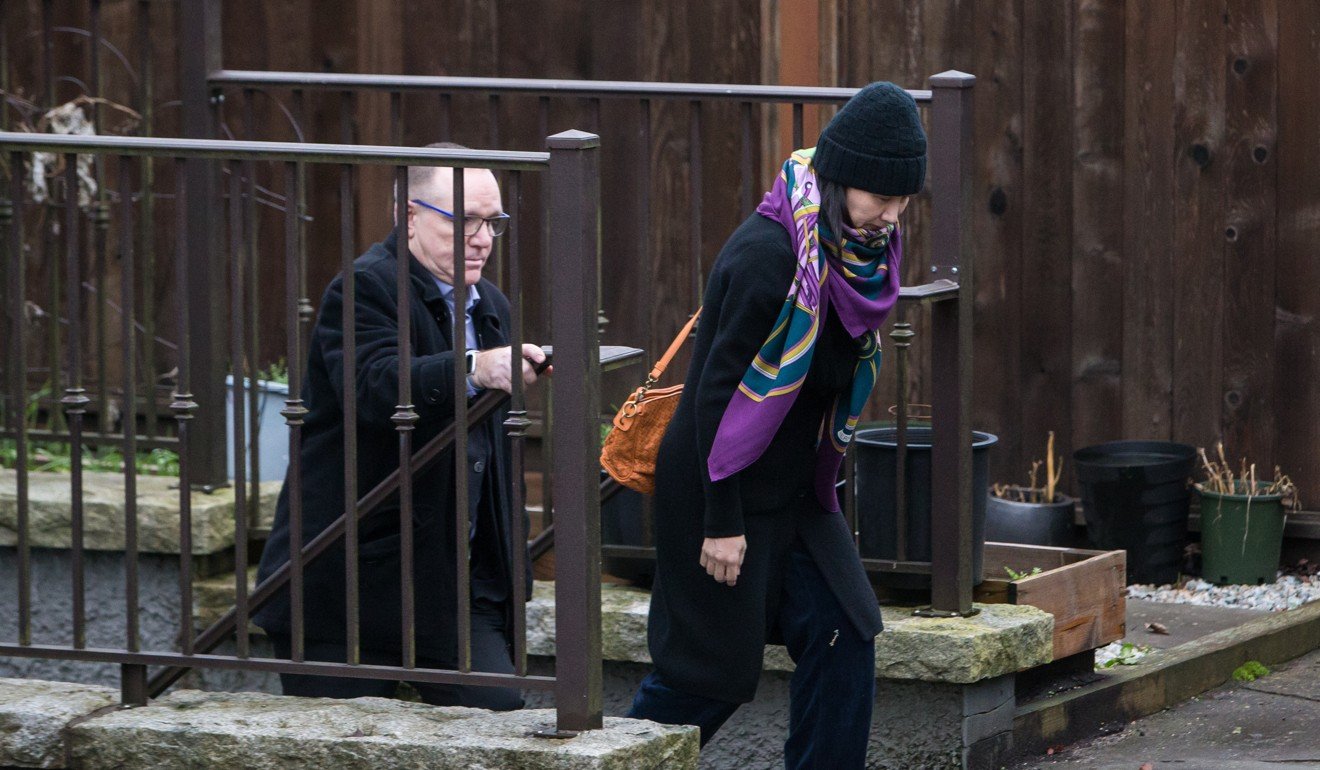 Meng Wanzhou, chief financial officer of Huawei Technologies, leaves her home under the supervision of a private security guard in Vancouver, Canada, on December 12. Photo: Bloomberg