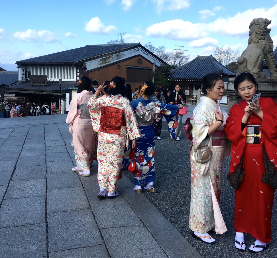 Chinese tourists in traditional Japanese clothing, in Kyoto. Picture: Adam Nebbs