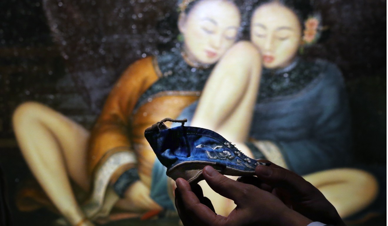A tiny shoe worn by women with bound feet is displayed at Sotheby's in Hong Kong. Picture: Nora Tam