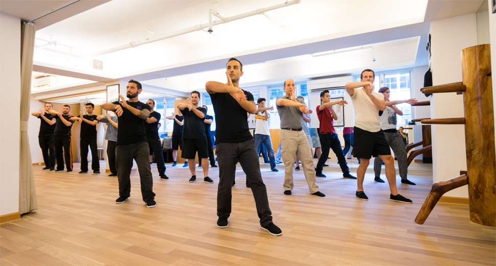 The class at Mindful Wing Chun begins with gentle mobility exercises.